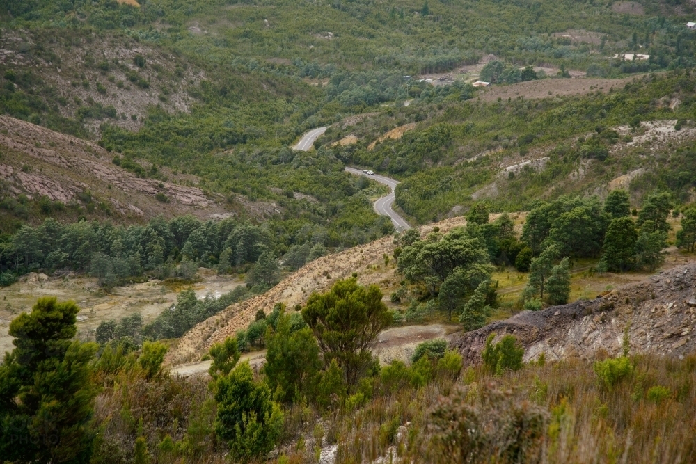 Distant Winding Road through valley in Tasmanian Central Highlands - Australian Stock Image