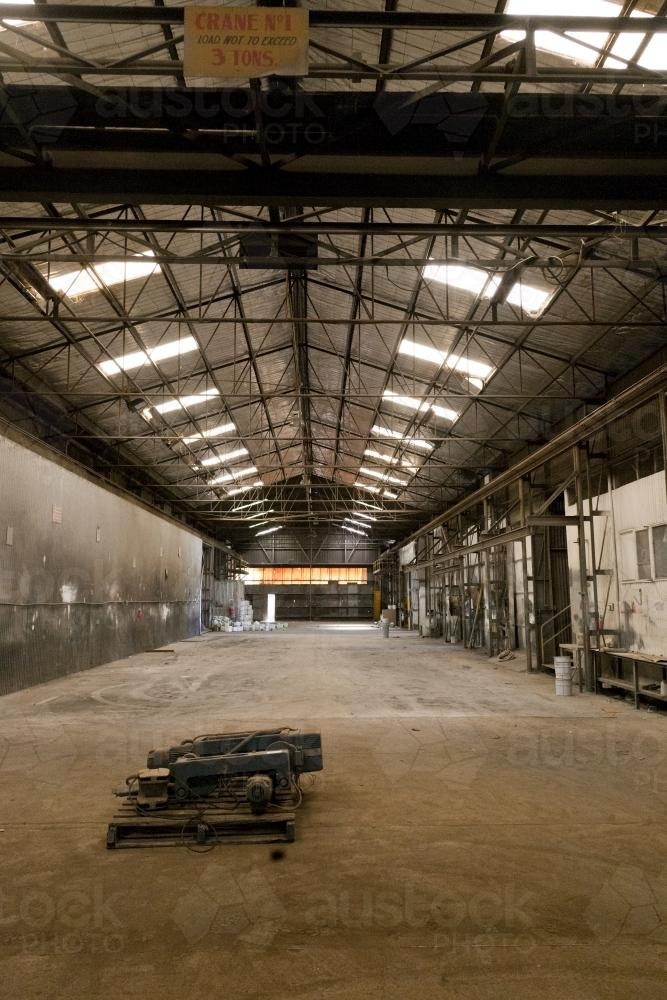 Disused factory space showing a vast empty warehouse - Australian Stock Image