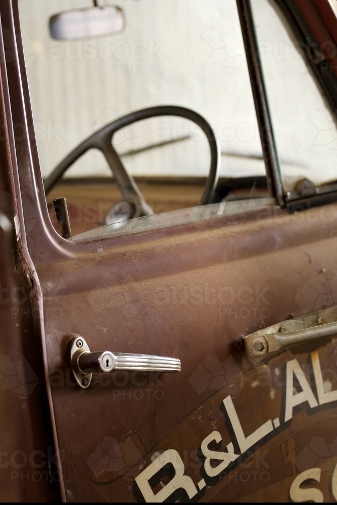 Door handle and steering wheel on old truck - Australian Stock Image