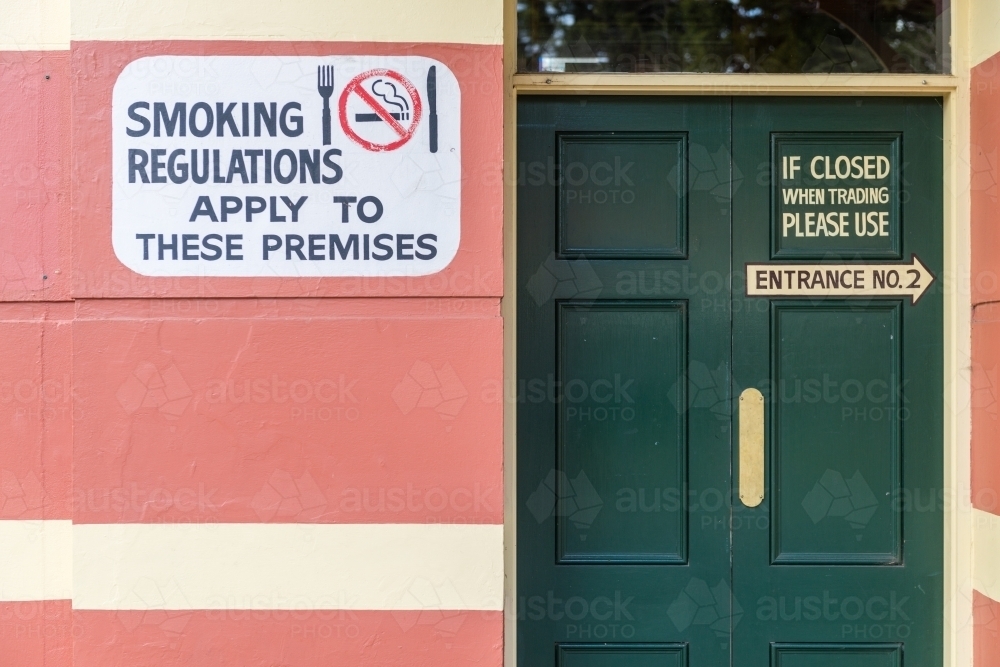 Image of doors and signs on an Australian country pub - Austockphoto