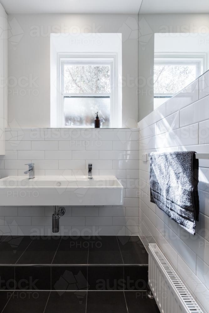 Double basin vanity in modern white renovated bathroom in heritage building - Australian Stock Image