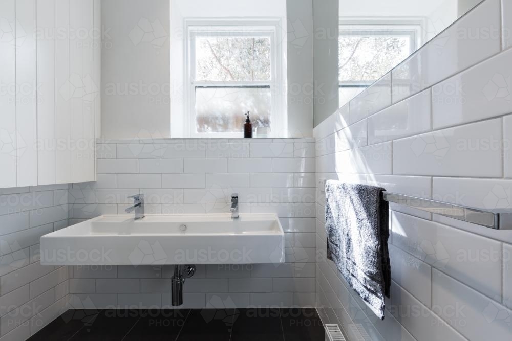 Double basin vanity in modern white renovated bathroom in heritage building horizontal - Australian Stock Image
