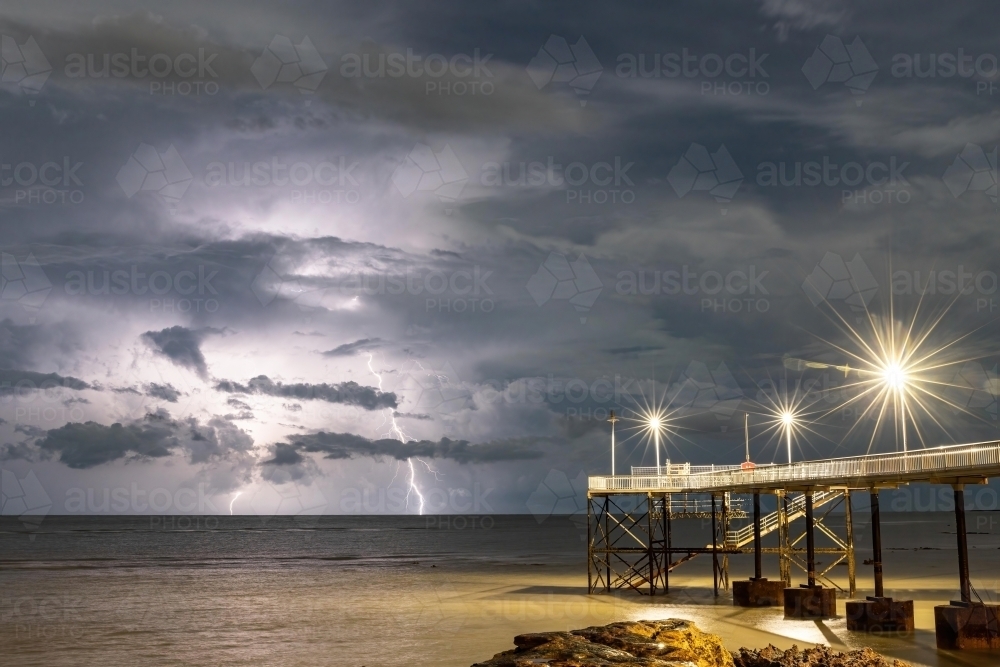 Double lightning strike at Nightcliff Jetty at night - Australian Stock Image