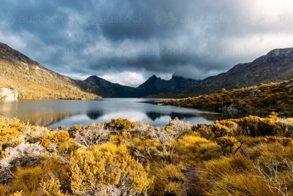 Dove Lake and Cradle Mountain on a cool stormy spring afternoon near sunset in Tasmania - Australian Stock Image