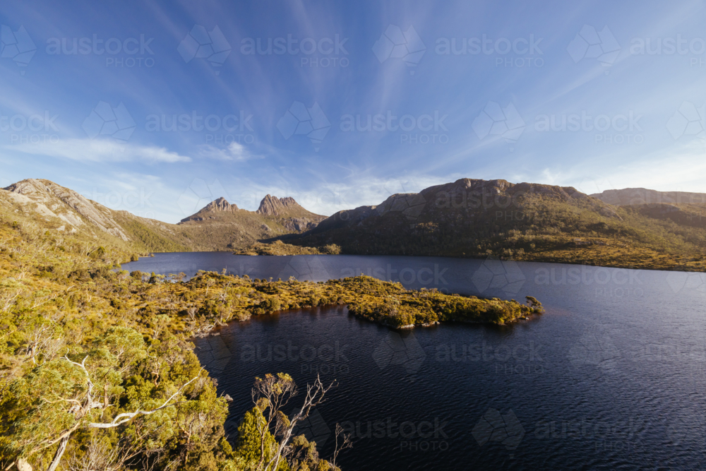 Dove Lake and Cradle Mountain on a warm autumn afternoon near sunset in Cradle Mountain, Tasmania - Australian Stock Image