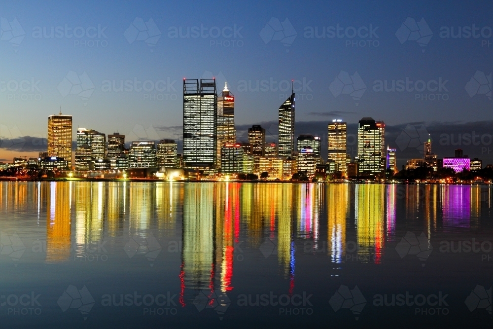 Downtown city lights of Perth CBD reflecting on the Swan River. - Australian Stock Image