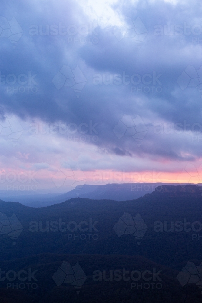 Dramatic clouds in dusk sky at sunset in Blue Mountains - Australian Stock Image