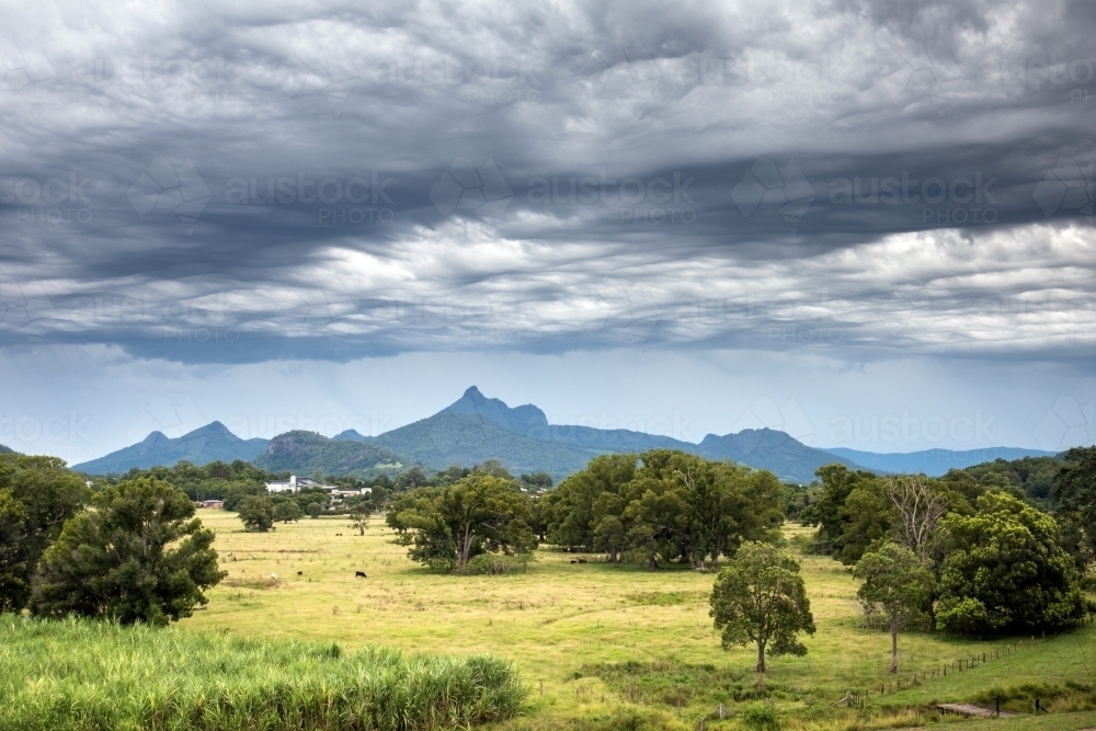 Dramatic storm clouds over mountain region - Australian Stock Image