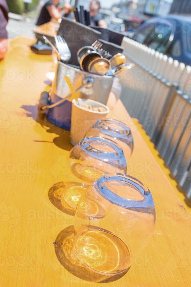 Image of Drinking glasses on a table - Austockphoto