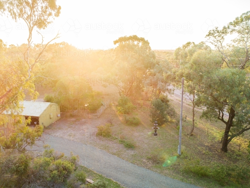 Driveway and green shed on rural property - Australian Stock Image