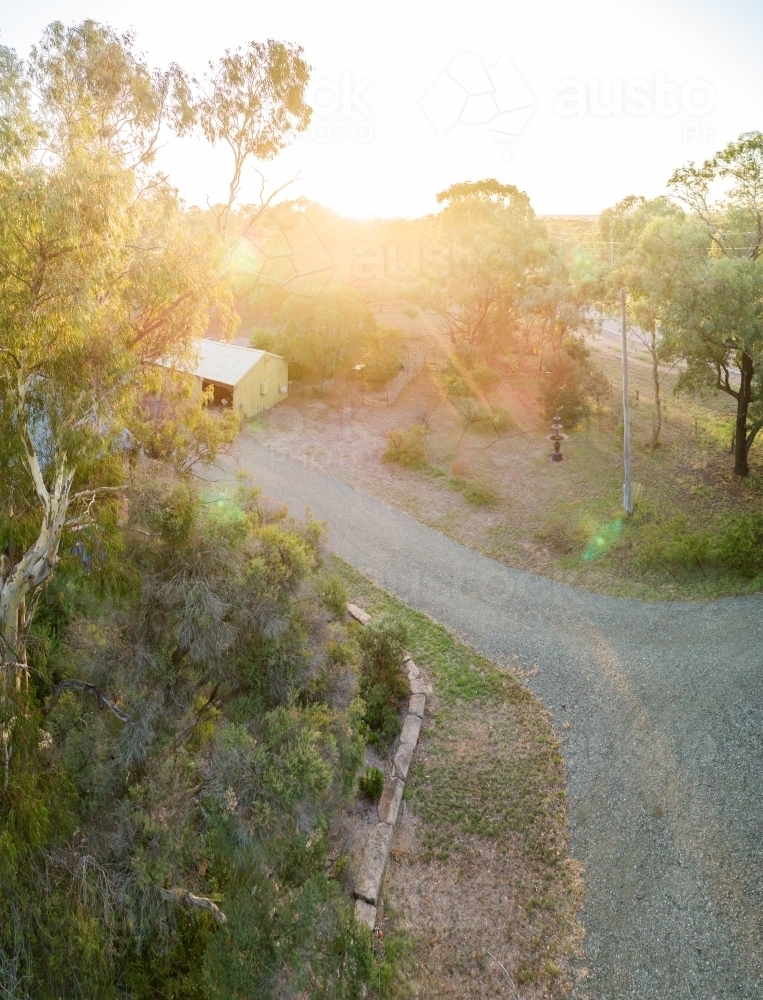Driveway and green shed on rural property - Australian Stock Image