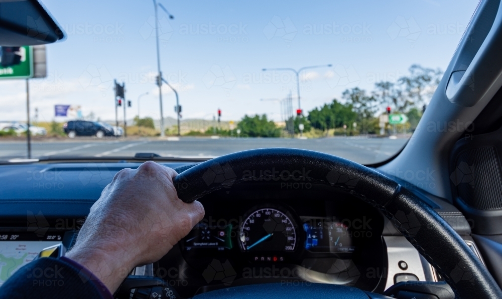 Image of Driving a Car as seen from the Driver's View - Austockphoto