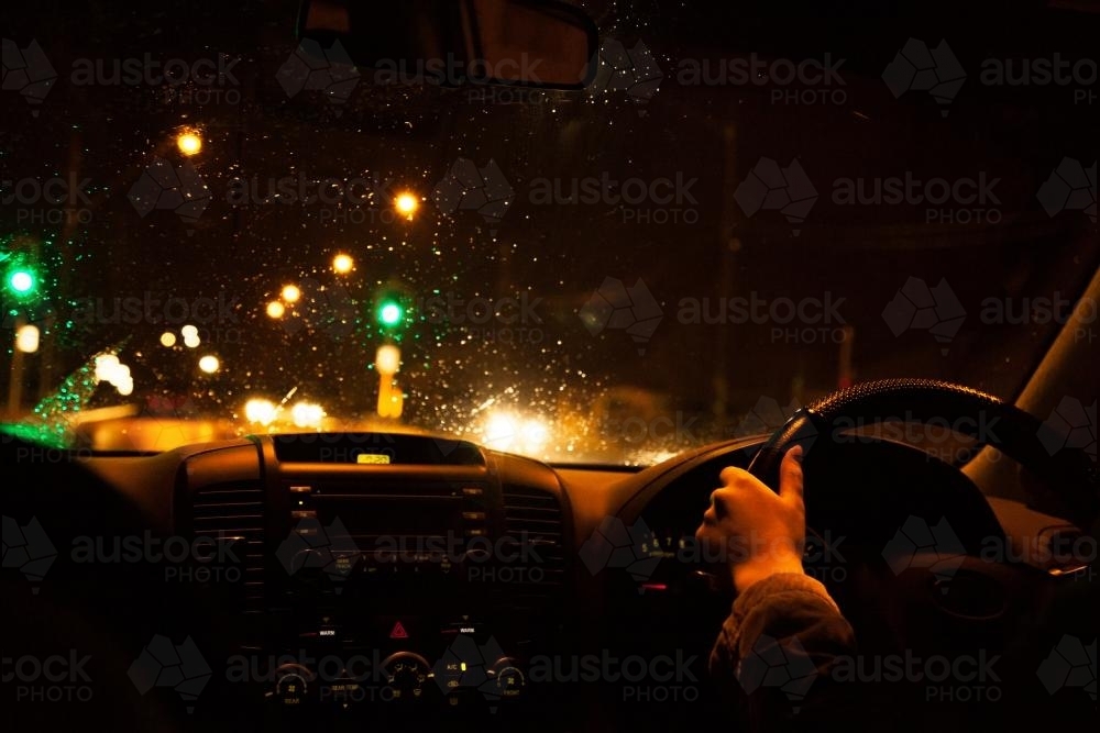 Driving in the rain late at night - Australian Stock Image
