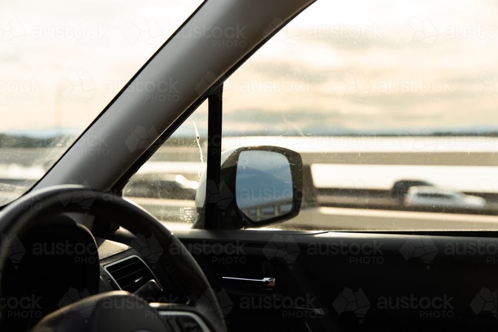 driving over a bridge near Redcliffe in the afternoon light - Australian Stock Image