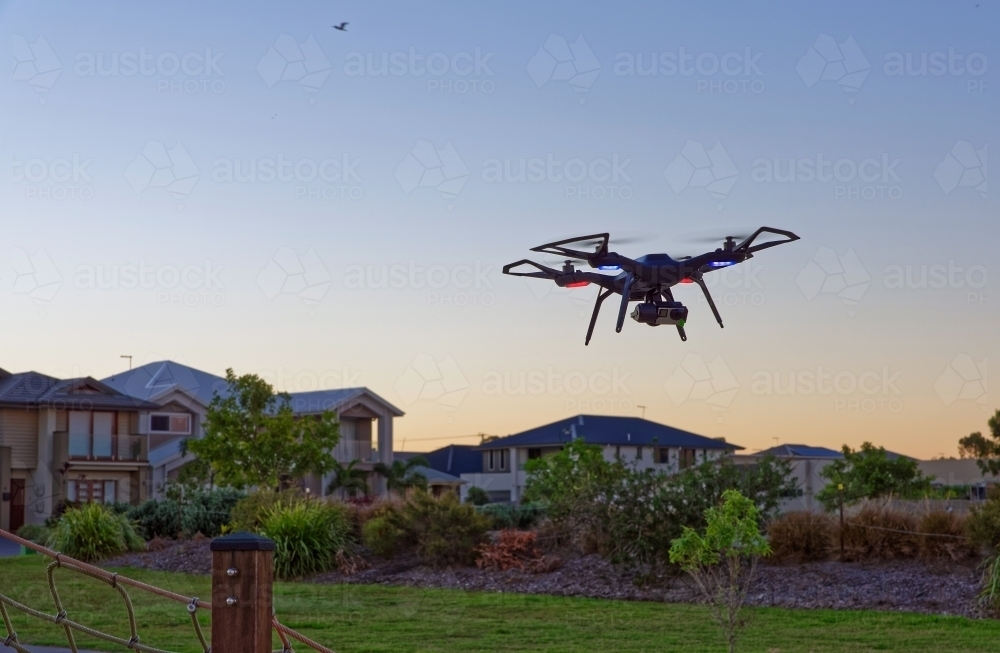 Drone flying at sunset in empty park with copy space - Australian Stock Image