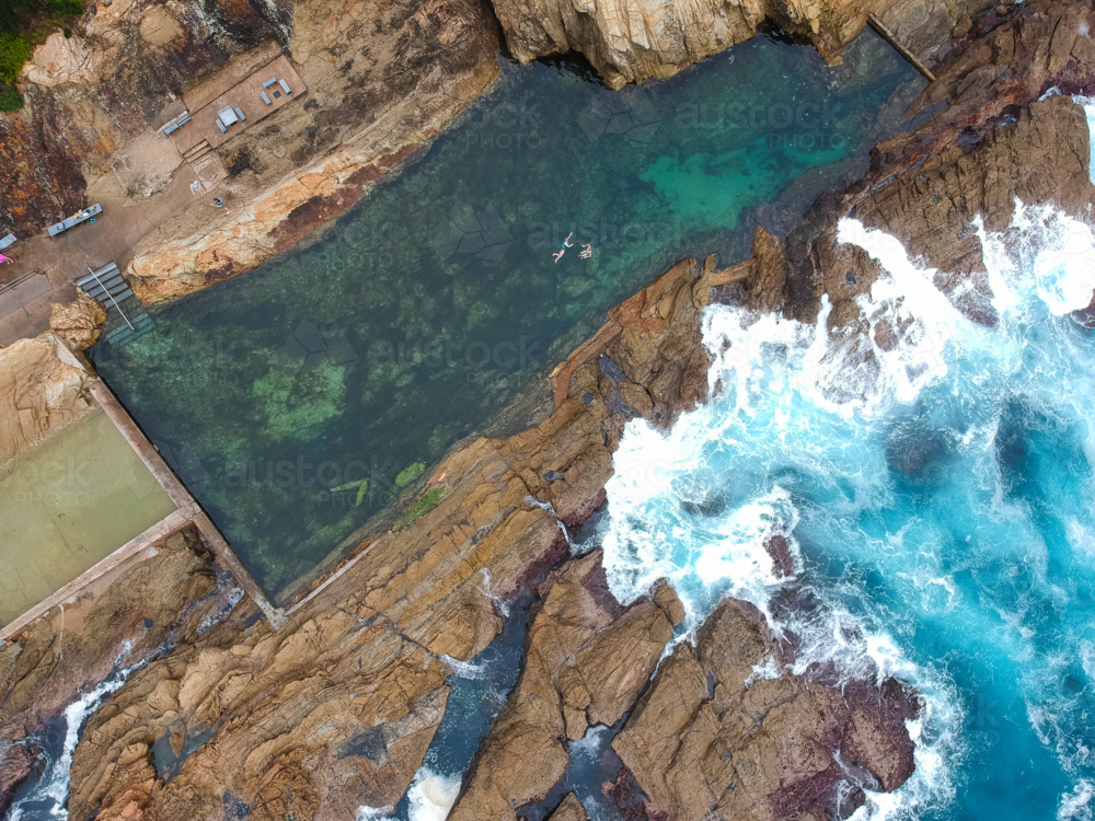 Drone image of ocean pool with swimmers in New South Wales - Australian Stock Image