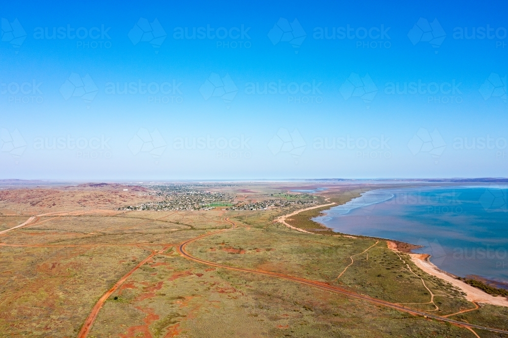 drone photo looking towards Karratha city with blue sky and sea - Australian Stock Image