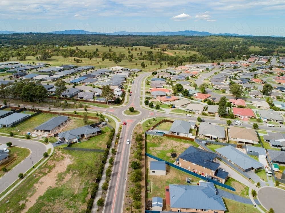 Drone photo of roundabout and houses in Hunterview - Australian Stock Image