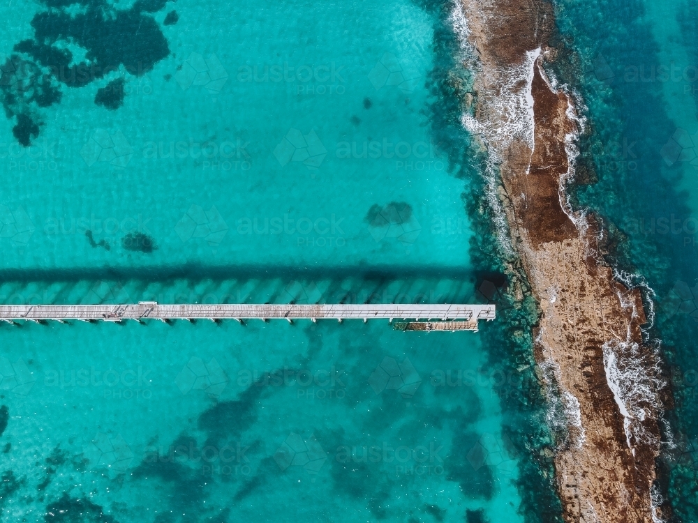 Drone photo of the ocean with reef and jetty - Australian Stock Image