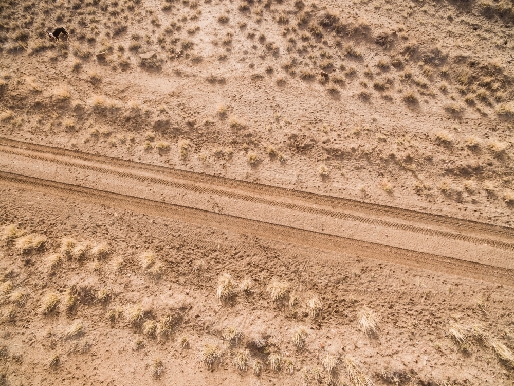 Drone shot looking down of outback road - Australian Stock Image