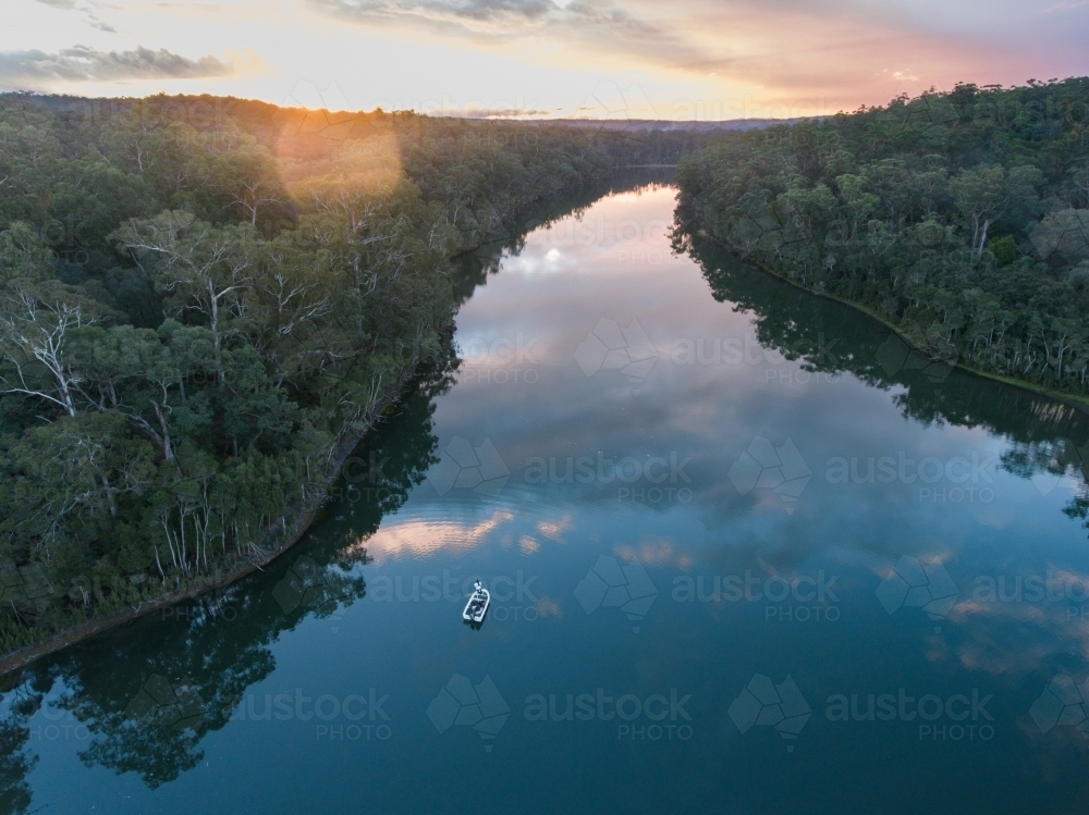 Drone Shot of a Boat on Nowa Nowa River at Dusk - Australian Stock Image