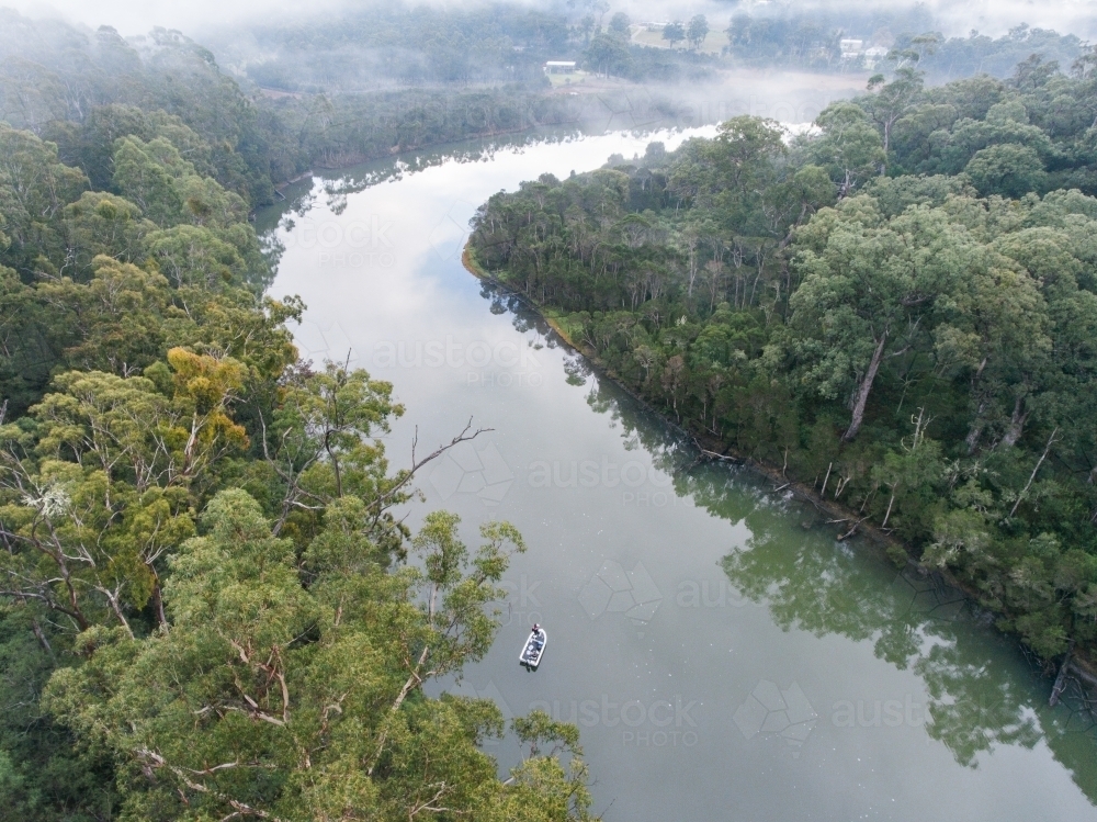 Drone Shot of a Fishing Boat on River in Nowa Nowa - Australian Stock Image