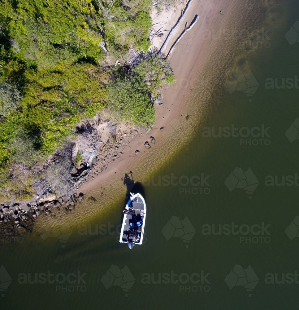 Drone Shot of a Recreational Fishing Boat on a River Bank - Australian Stock Image