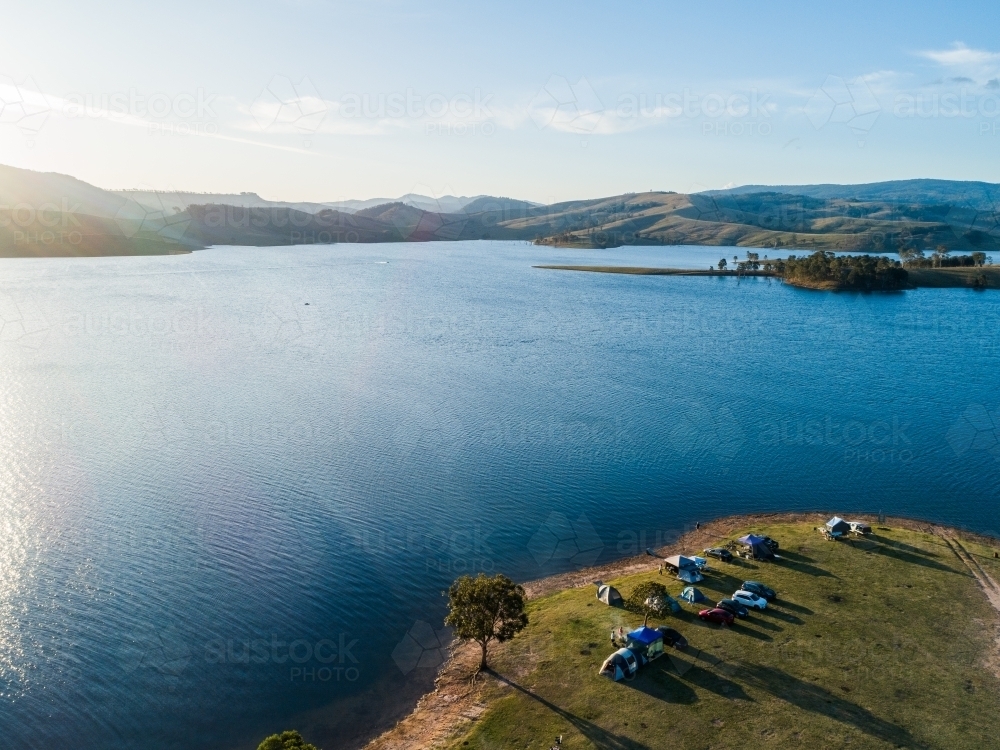 Drone view of campsite beside water of Lake St Clair in Hunter Valley - Australian Stock Image