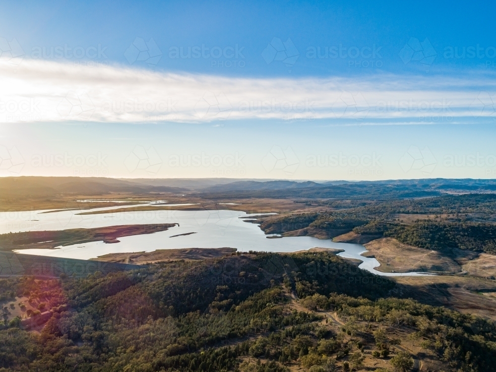 Drought causing low water level in lake Burrendong surrounded by dry Aussie landscape - Australian Stock Image