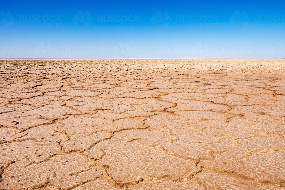 dry lake bed and blue sky - Australian Stock Image