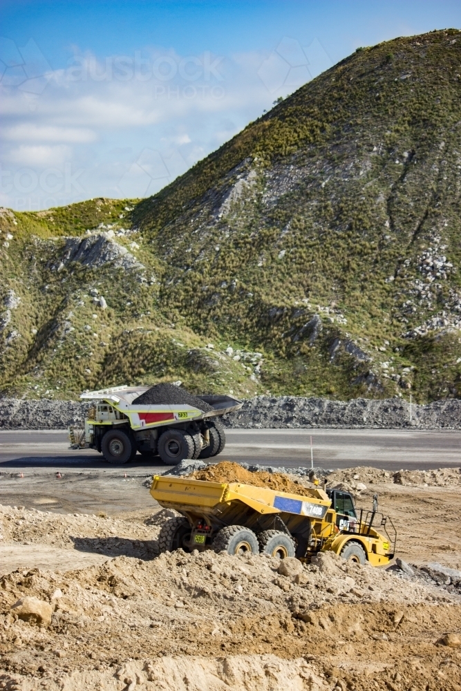 Dump truck carting coal through open cut mine in the Hunter Valley - Australian Stock Image