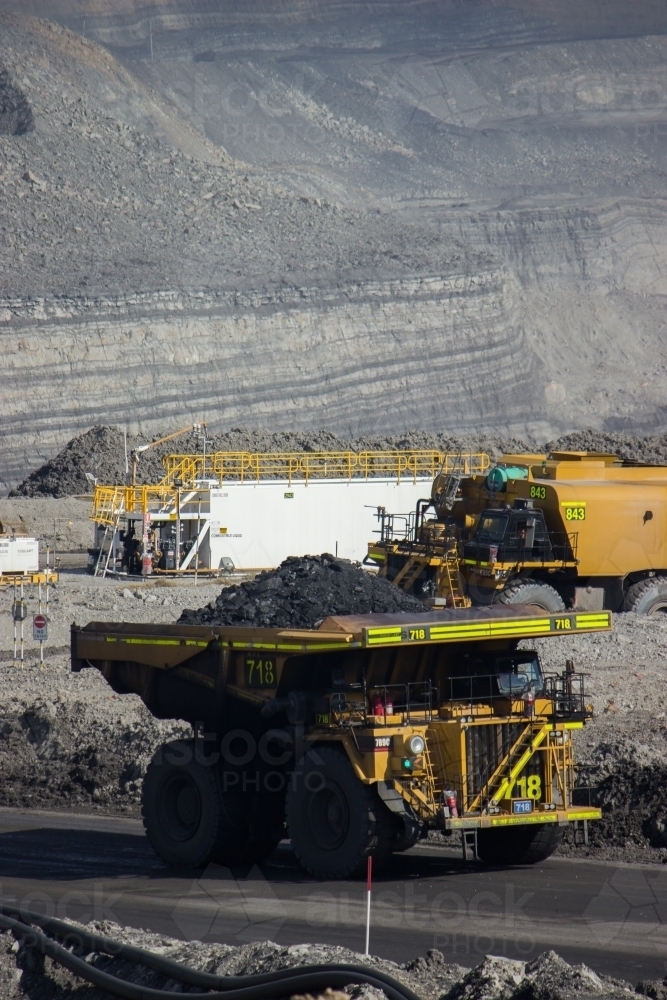 Dump truck carting coal through open cut mine in the hunter valley - Australian Stock Image