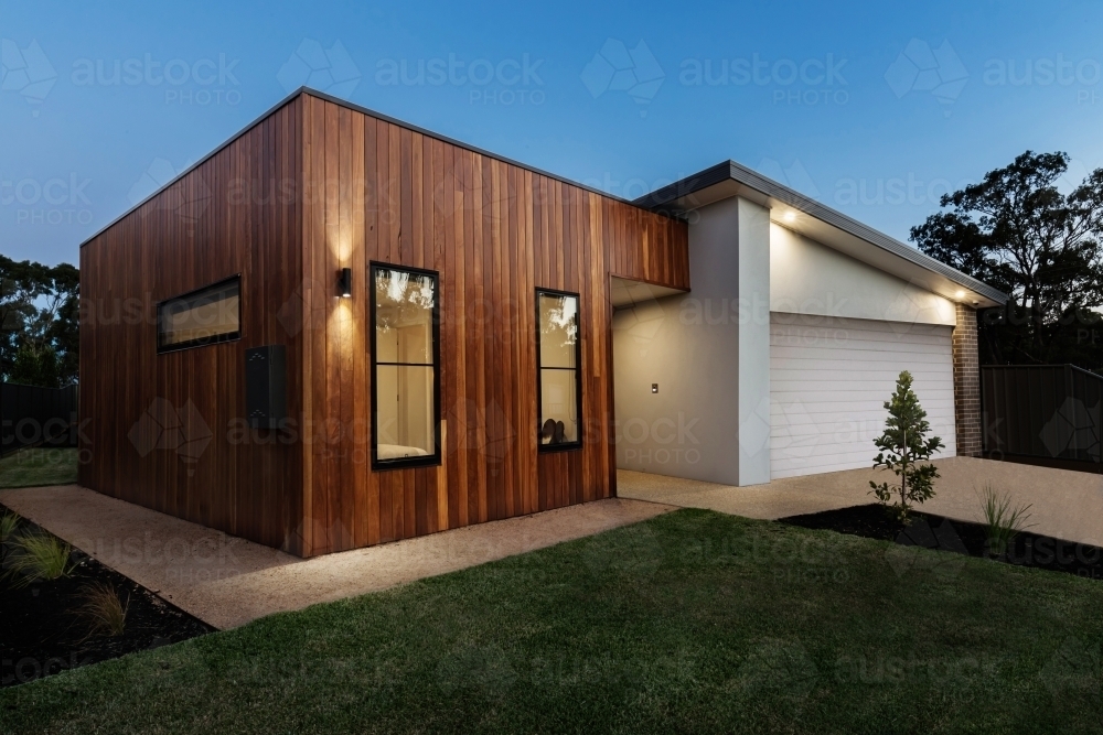 Dusk shot of a modern home with external lighting - Australian Stock Image