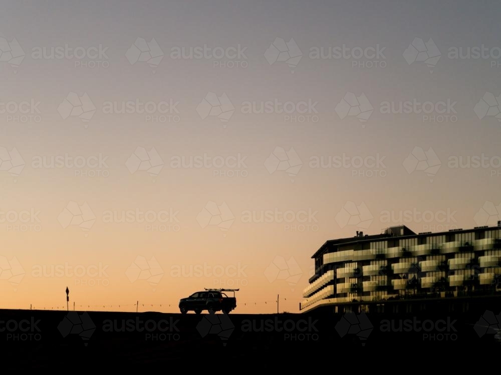 Dusk silhouette car and a hotel on Mt Panorama Racing Circuit - Australian Stock Image