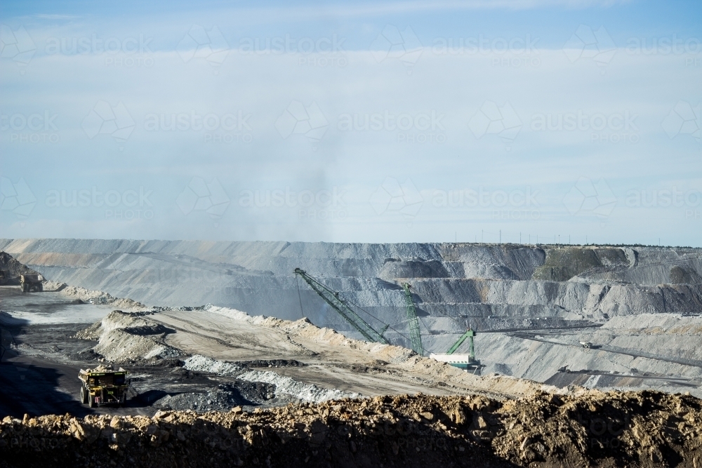 Dust from mining activity floating from open cut coal mine - Australian Stock Image
