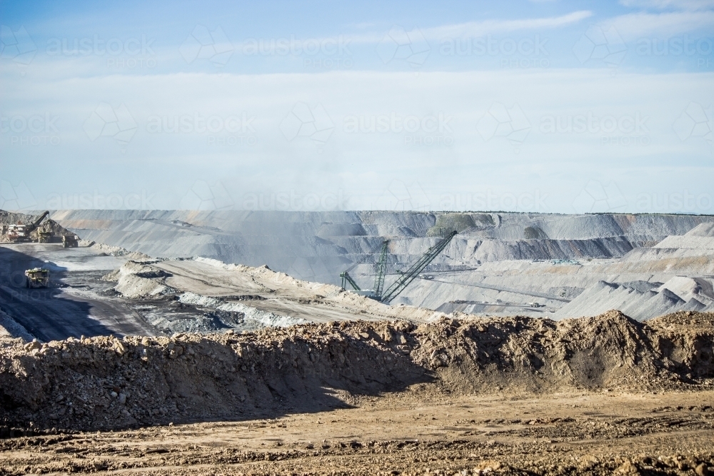 Dust from mining activity floating from open cut coal mine - Australian Stock Image