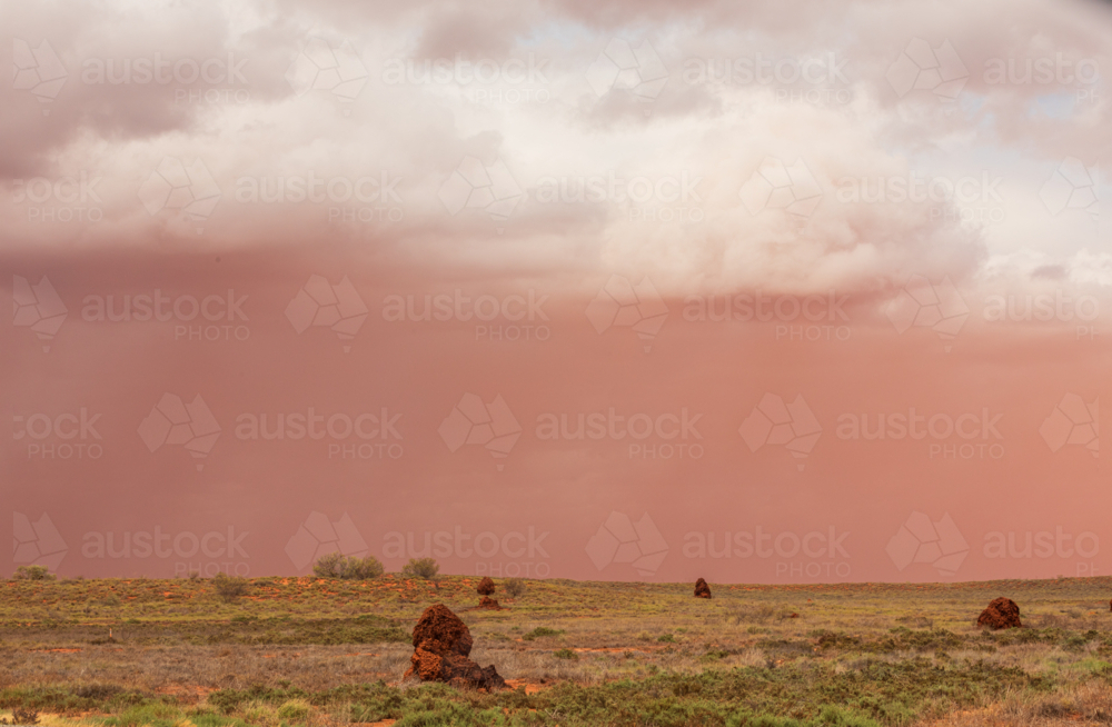 Dust storm form Cyclone Sean, above termite mounds in Pilbara - Australian Stock Image