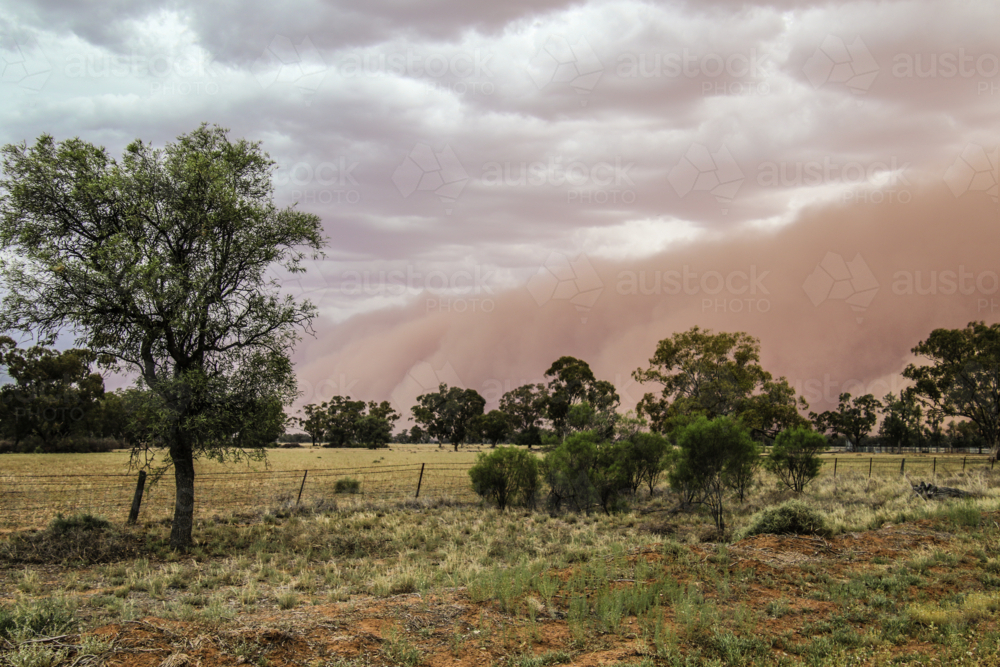 Dust storm in the sky over vast farmland - Australian Stock Image