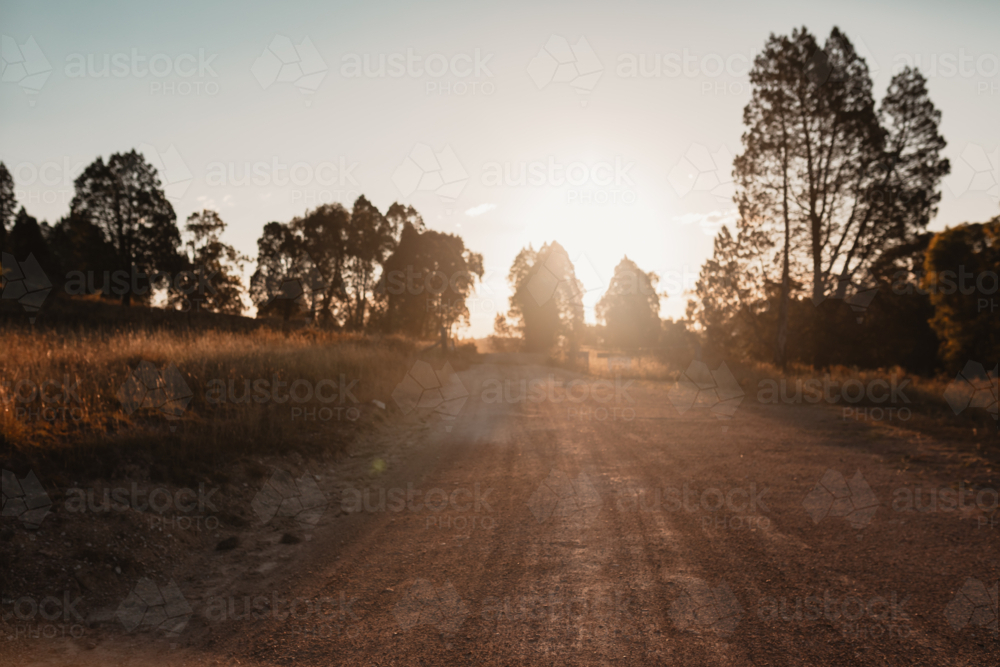 Image of Dusty country road in rural Australia at sunset - Austockphoto