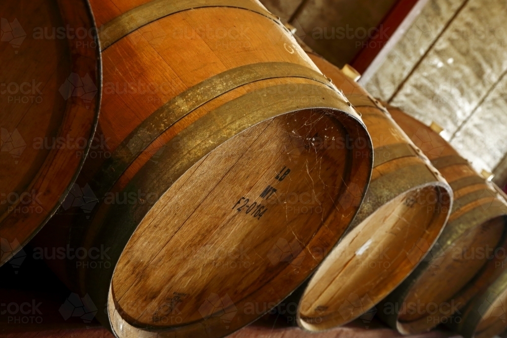 Dusty oak wine barrels in a Western Australia winery. - Australian Stock Image