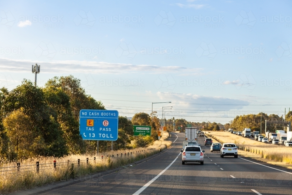 E tag no cash booths sign on roadside of inner city bypass - Australian Stock Image