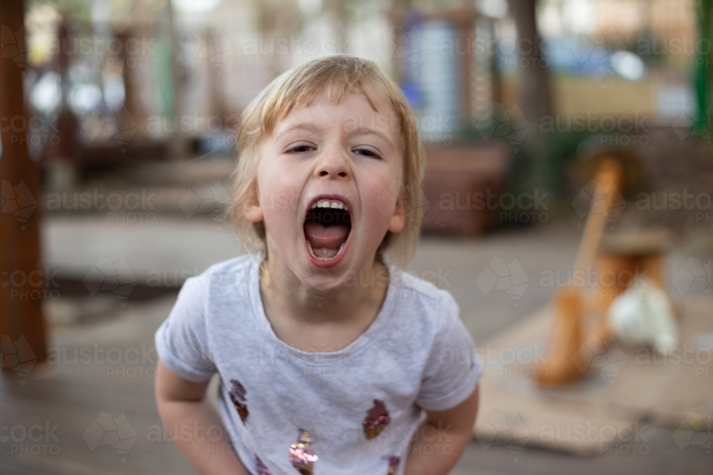 Early education, child pretend growling - Australian Stock Image