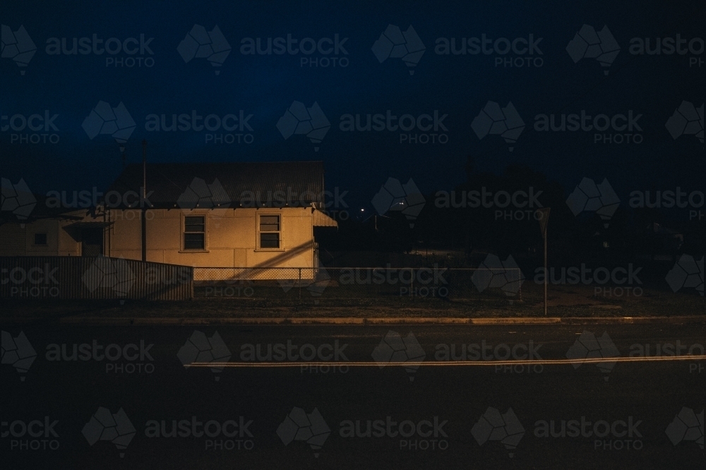 Early evening in regional town with house and street light - Australian Stock Image