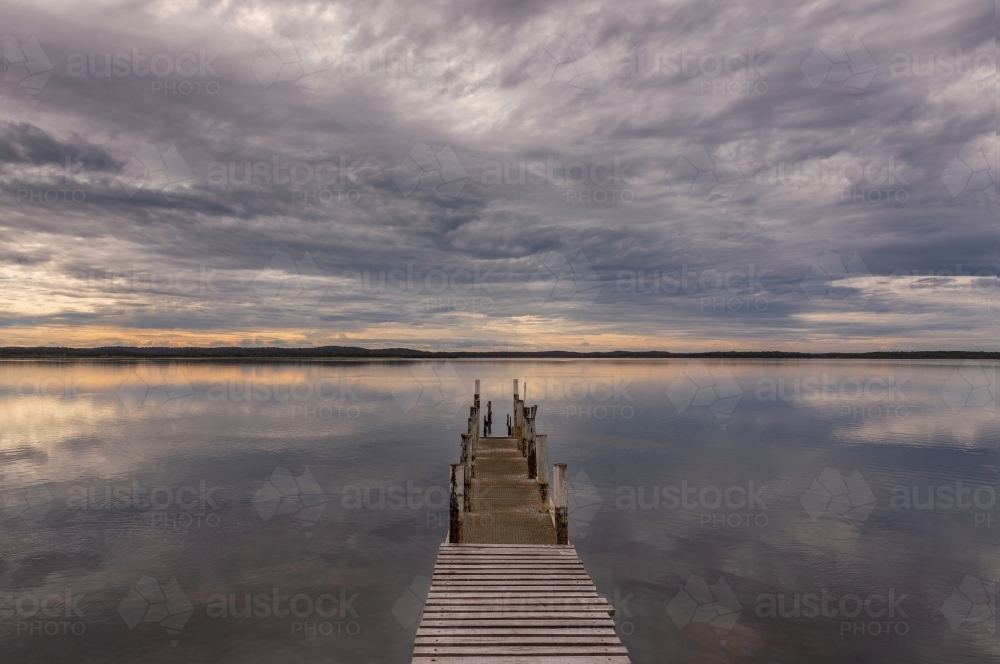 Early morning light at old wooden pier on Bemm River - Australian Stock Image