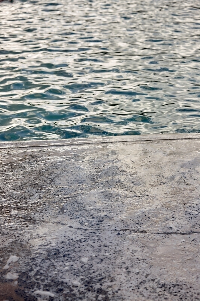 Edge of concrete floor at sea pool - Australian Stock Image