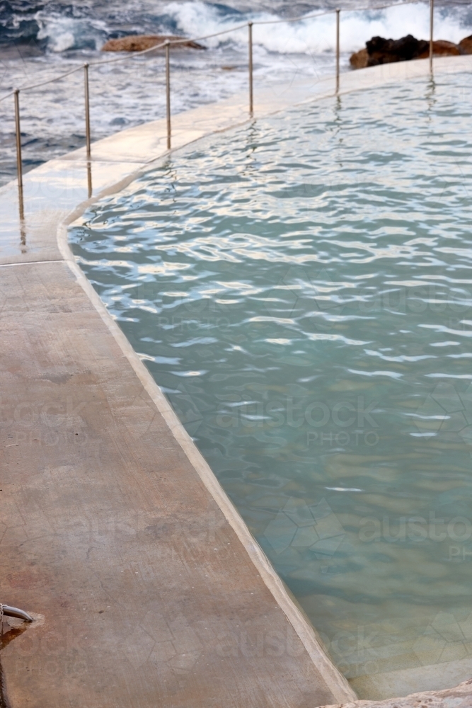Edge of concrete floor at sea pool - Australian Stock Image