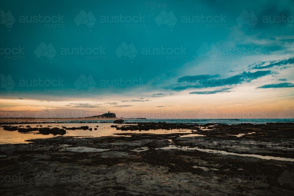 Eerie sunset at Nobby's Beach in Newcastle - Australian Stock Image