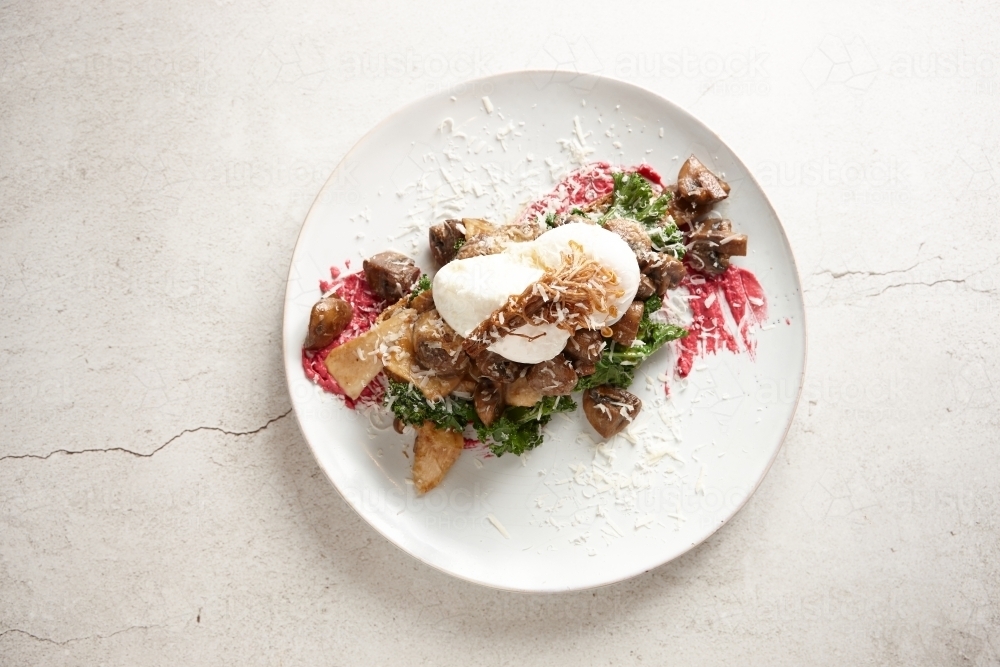 Eggs and mushroom dish on plate - Australian Stock Image