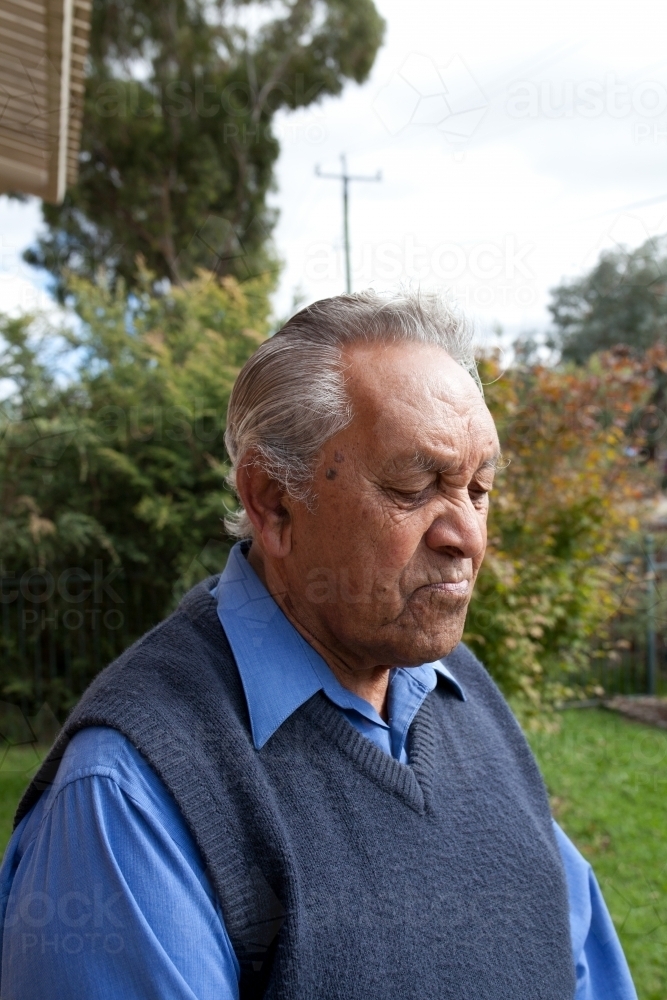 Elderly aboriginal  man outdoors - Australian Stock Image