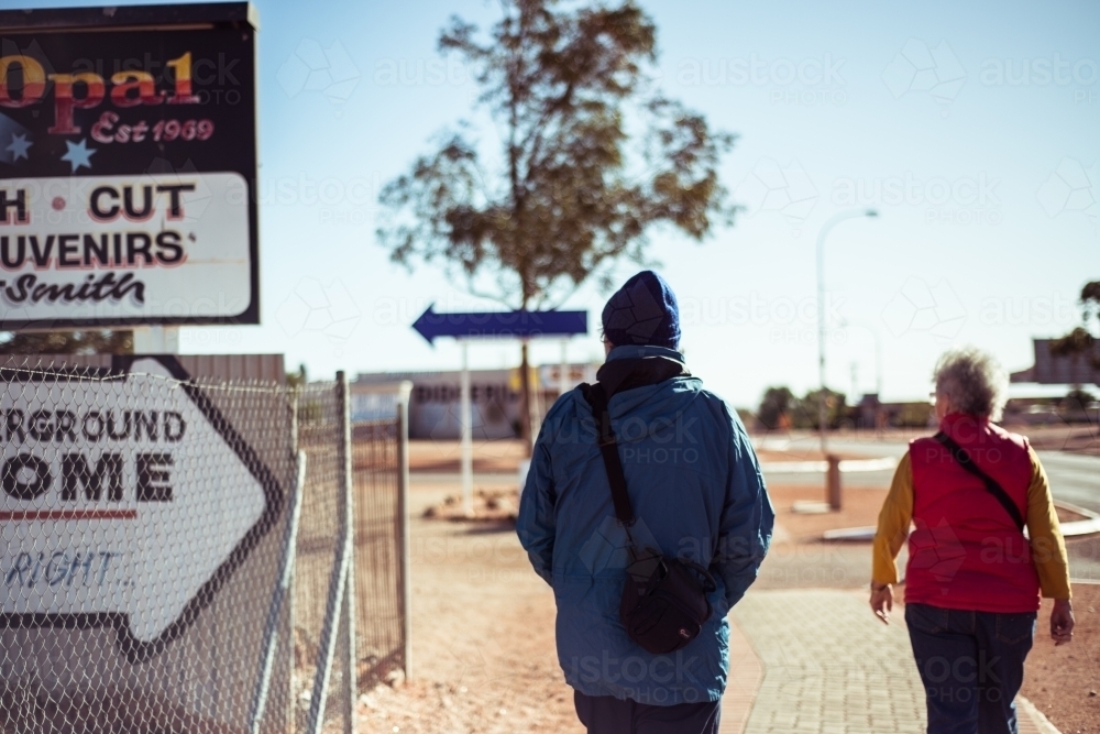 Elderly couple walking through Alice springs - Australian Stock Image
